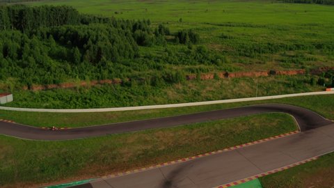 Kart racing or karting training. Kart, go-kart moving on race track. Aerial view of auto circuit