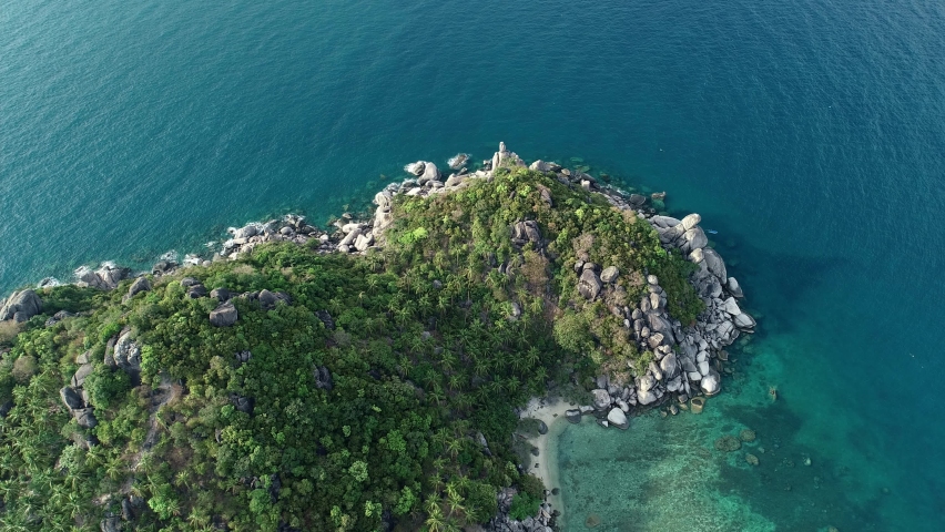 Beautiful Seashore tropical sea at Koh Tao island in summer season blue sky footage from drone aerial view Amazing dynamic shot nature footage from drone camera High angle view High quality video Royalty-Free Stock Footage #1077721238