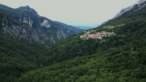 Flight over Italian village in the mountains
