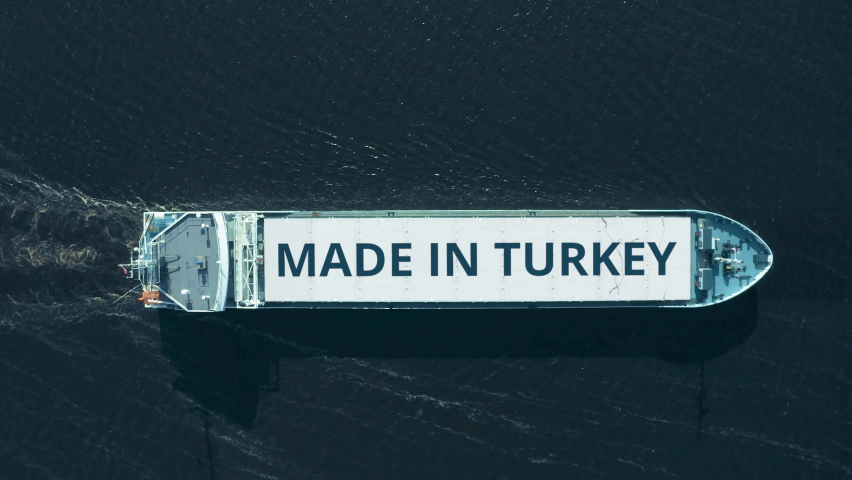 Top down aerial view of a cargo ship with MADE IN TURKEY text