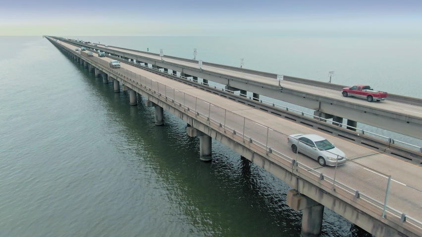 Aerial: Traffic on the Lake Pontchartrain causeway, New Orleans. Louisiana, USA | Shutterstock HD Video #1077724172