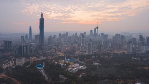 Sunrise Time lapse : Aerial wide angle view of Kuala Lumpur city at dawn overlooking KL skyline in Malaysia. 