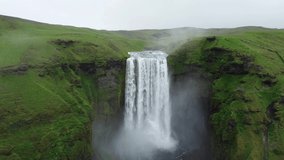 Skogafoss waterfall in iceland. Aerial drone video of Icelandic landscape. Famous tourist attractions and landmarks destinations in Icelandic nature on Iceland. 4K drone UHD video.
