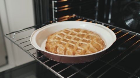No people slow-motion close-up of delicious just made apple pie in oven