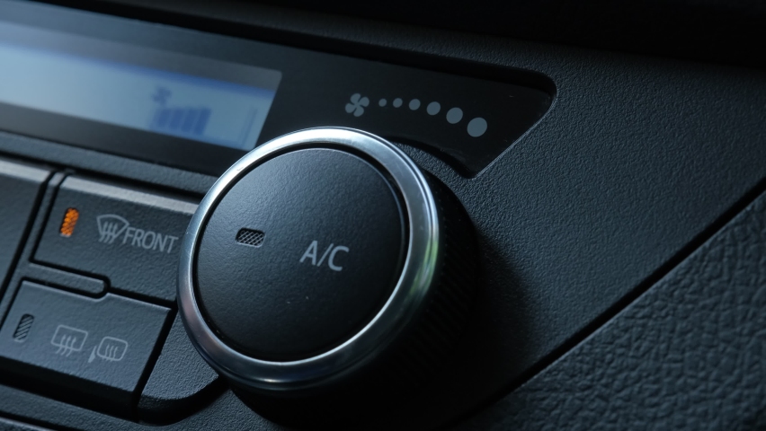 Caucasian Male Driver Manipulating Car Air Conditioning Knob Switch Button with Status LED | Shutterstock HD Video #1077746156