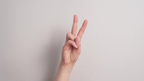 Letter V In Sign Language - Communication For Deaf. - Closeup Shot