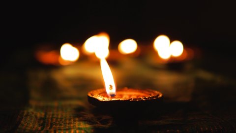 Focusing Diya on the front to Diya on back. Diwali festival. Beautiful oil lamps decorated on the occasion of Diwali, celebrated by Hindus also known as the festival of lights.