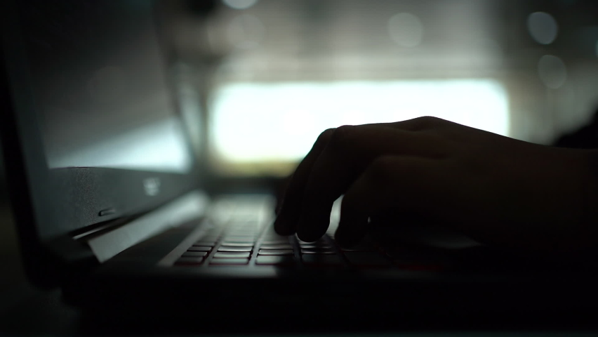 Hacker using the Internet hacked abstract computer server, database, network storage, firewall, social network account, theft of data with silhouette footage. Royalty-Free Stock Footage #1077752084