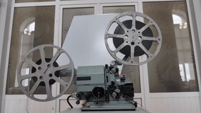Old Film Projector. Slider View - Powered by Shutterstock - Get 15% off with code: PIKWIZARD15