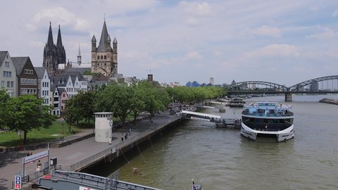 Sightseeing boats on River Rhine in Cologne - COLOGNE, GERMANY - JUNE 25, 2021