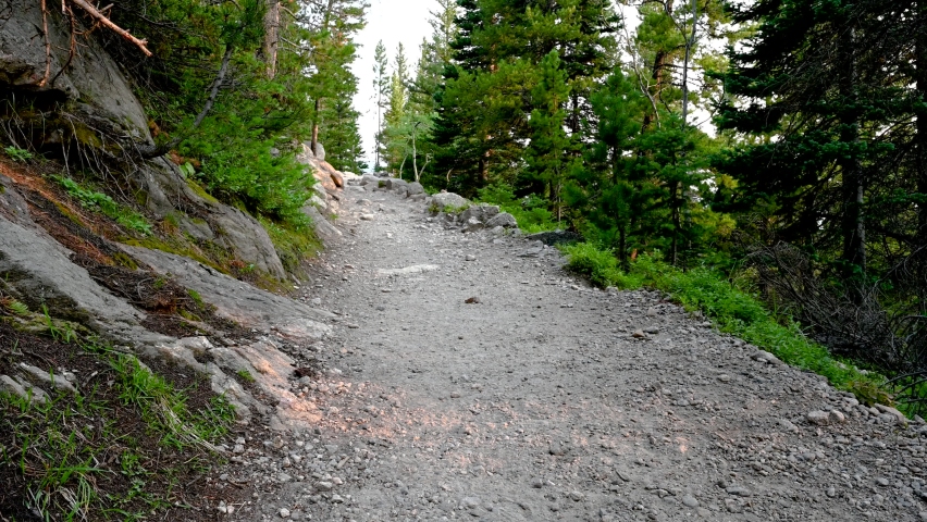 A hiker makes his way up a steep trail in Rocky Mountain National Park, Colorado, USA.