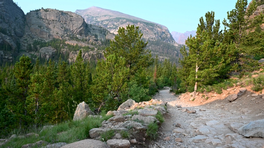 Hiking a dirt and rock path in Rocky Mountain National Park, Colorado, USA