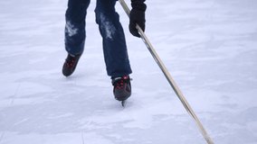 Kid playing hockey on a frozen ice. Close-up on Ice. 4k - Powered by Shutterstock - Get 15% off with code: PIKWIZARD15
