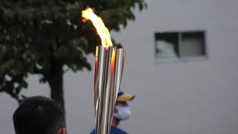 YAMANSHI, JAPAN - JUNE 2021 : Close up shot of torch flame. Tokyo 2020 Summer Olympic Torch Relay at Yamanashi area.