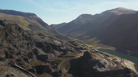 Aerial reveal and establishing footage of Dinorwig Quarry. An old slate mine in wales.
