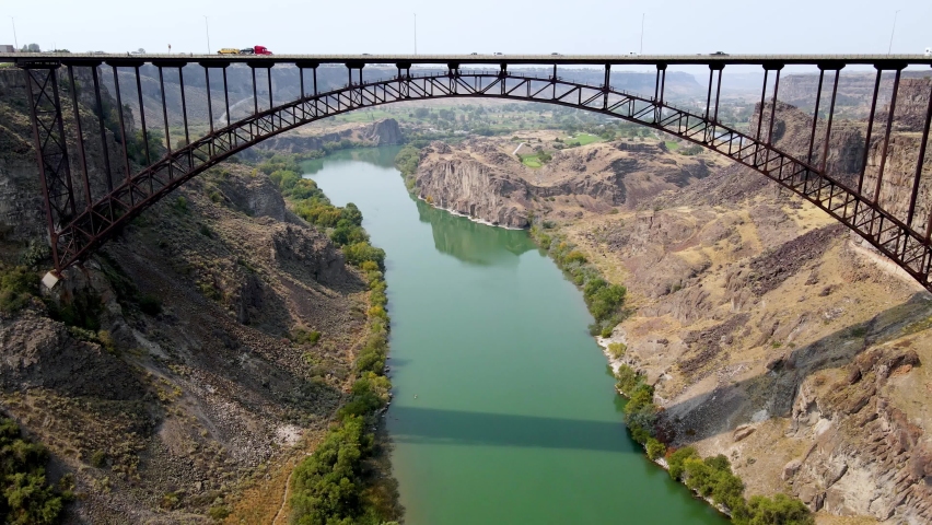 Aerial view of the Perrine Memorial Bridge over the snake river in Twin Falls, Idaho. With cars driving across the bridge.