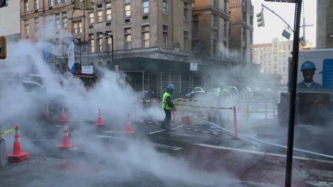 NEW YORK, New York City – DECEMBER 26 2020: Con Edison maintenance crew work on the Second Avenue in the cold morning at East Village New York City NY USA on December 26, 2020. 