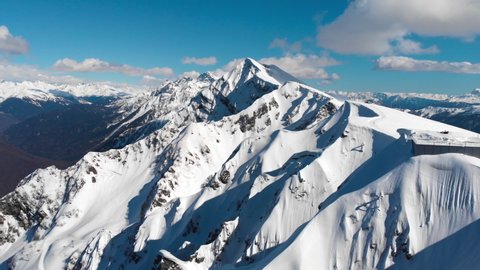 Aerial view of idyllic arctic landscape. Adventure, travel and background concept. Drone fly over majestic winter snowy mountain peaks.