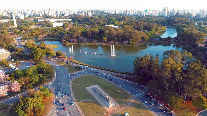 Metropolis aerial landscape of city of Sao Paulo, Brazil. Landmark avenue and buildings of city. Independence square. Independence monument. Ibirapuera park. Ibirapuera lake. Sao Paulo, Brazil. | Shutterstock HD Video #1077813869