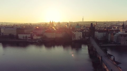 Aerial view of Prague Old Town architecture and Charles Bridge over Vltava river at sunset. Old Town of Prague, Czech Republic.