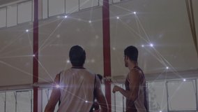 Animation of network of connections over basketball match in gym. global sports, fitness and data processing concept digitally generated video.