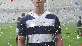 Animation of confetti over male rugby players during match at stadium. sport and competition concept digitally generated video.