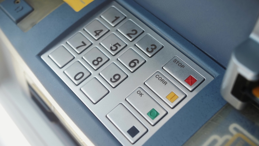 ATM Banking. Enter pin code in cash machine. Close up of person typing personal pin code in ATM cash machine. Royalty-Free Stock Footage #1077846965