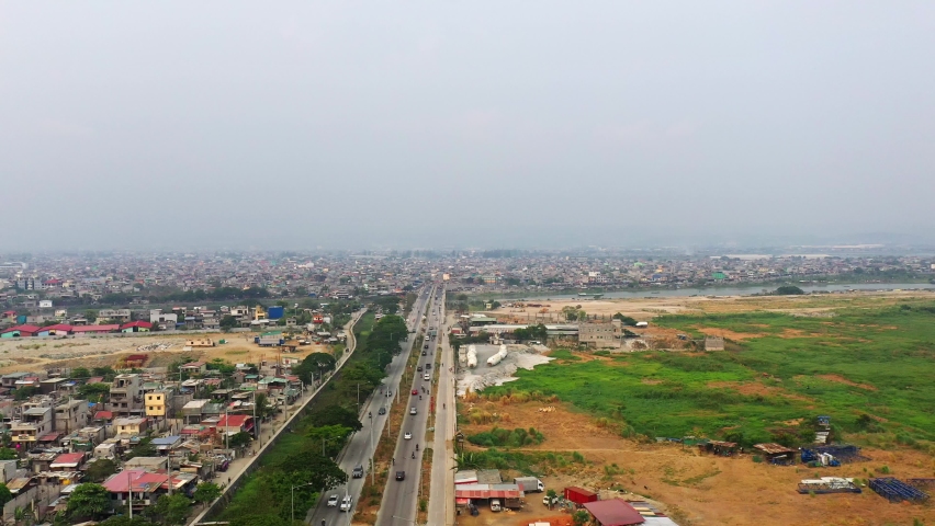 Traveling Cars On City Road Of Taguig In Metro Manila, Philippines. - Aerial