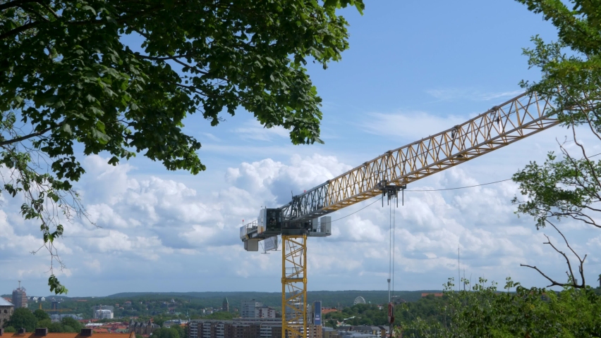 Yellow crane swinging from right to left in göteborg, Sweden