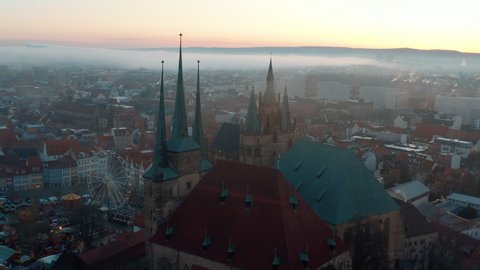 Aerial Panning Shot Of Famous Church In Old Town Against Sky During Sunrise - Erfurt, Germany