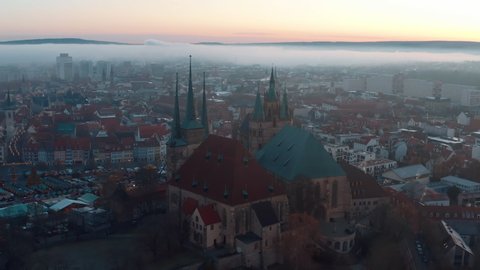 Aerial Downward Shot Of Beautiful Famous Church In Old Town During Foggy Weather - Erfurt, Germany