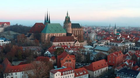Aerial Forward Shot Of Famous St. Severus Church Amidst Houses In Old Town During Sunrise - Erfurt, Germany