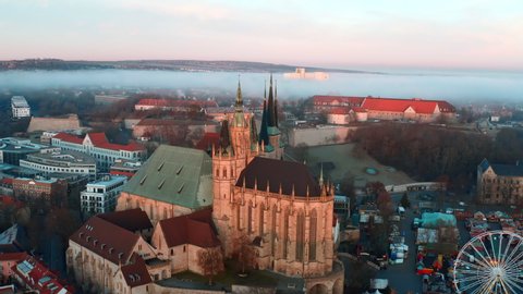 Aerial Panning Beautiful Shot Of Famous Church In Old Town, Drone Flying Over Houses During Sunrise - Erfurt, Germany