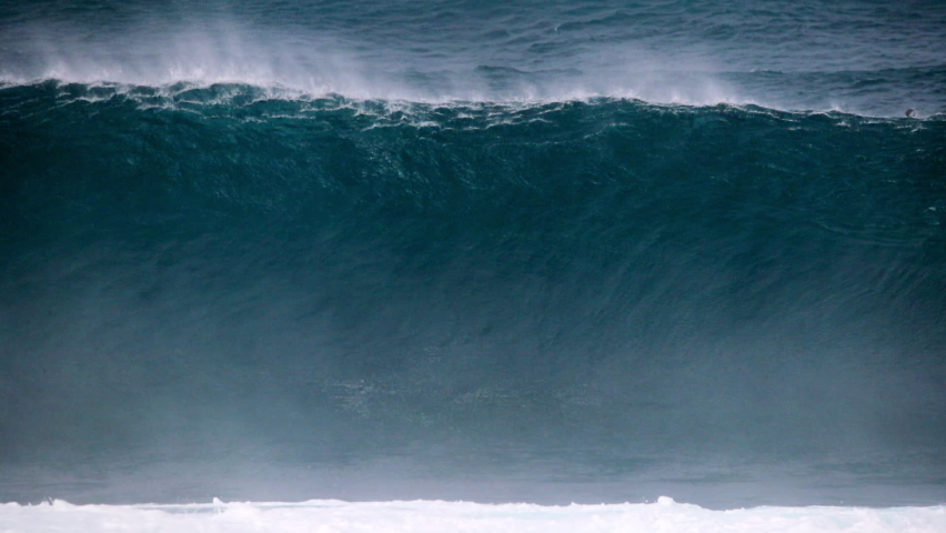 Slow Motion Tracking A Large Crashing Wave With Deep Blue Sea And White Surf Spray - Oahu, Hawaii
