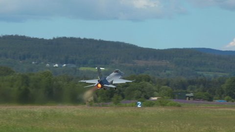 Kjeller Airport Norway - June 16 2021: airplane military f16 jet fighter norwegian air force taking off afterburner ambient sound