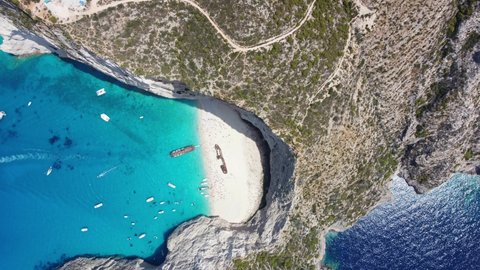 Navagio Beach - Tourists On Popular Shipwreck Beach With Remains Of MV Panagiotis In Greece. - aerial