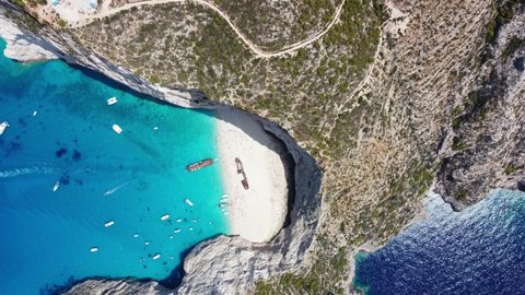 Aerial View Of Boats In Navagio Beach - Shipwreck Beach In Zakynthos, Ionian Islands Of Greece.