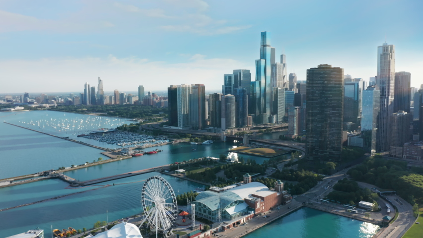 Chicago Illinois USA aerial drone footage of Chicago Navy Pier with Downtown skyscraper on cinematic background. Financial and residential buildings cityscape view on sunny summer day, 4K footage Royalty-Free Stock Footage #1077886547