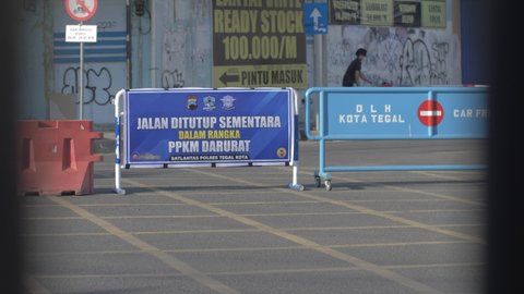 CENTRAL JAVA, INDONESIA - July 14th 2021: The Indonesian government has implemented a level-based Community Activity Restriction (PPKM) in Java-Bali. This implementation resulted in several road secti