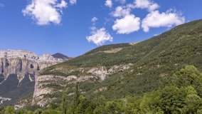 Panning timelapse video of clouds passing over the mountains in the monte pedido natural park in aragon spain