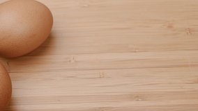 Slide shot of video 4k and full HD of quality healthy organic egg with eggshell isolated on clean background.