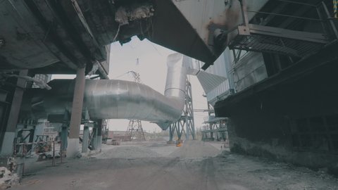 A large pipe at a metallurgical plant. Exterior of an industrial enterprise. Air duct in the factory