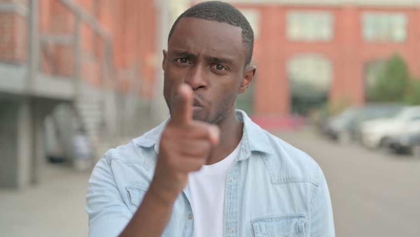 Outdoor Portrait of African Man Fighting in Anger