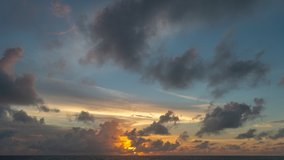 colorful light through to the cloud above the ocean.
Clouds are moving slowly in stunning sunset video 4K. Nature video High quality footage 
Scene of Colorful romantic sky sunset background.