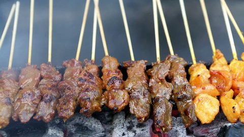 Chicken and beef satay a favourite Malaysian Cuisine andor Indonesian cuisine located in Jalan Alor a famous food street located in Bukit Bintang, Kuala Lumpur, Malaysia.