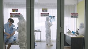 Doctors and nurses treating COVID-19 patients in sterile room, health care concept - Powered by Shutterstock - Get 15% off with code: PIKWIZARD15
