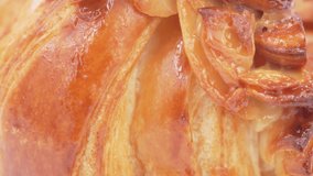 Almonds croissant rotating in front of camera, Close-up rotates view of Croissant with Honey Almond - Powered by Shutterstock - Get 15% off with code: PIKWIZARD15