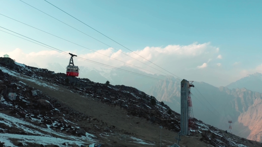 Aerial view of the cable car in Negi's Waichin Camps, a mountain top with snow at sunset, Kullu, Himachal Pradesh, c. | Shutterstock HD Video #1077950243