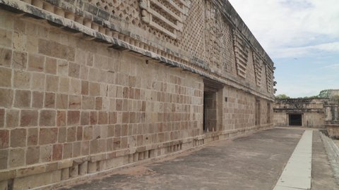 UXMAL, MEXICO - CIRCA 2021:  Decorated wall of Quadrangle of the Nuns building in ancient Mayan city of Uxmal