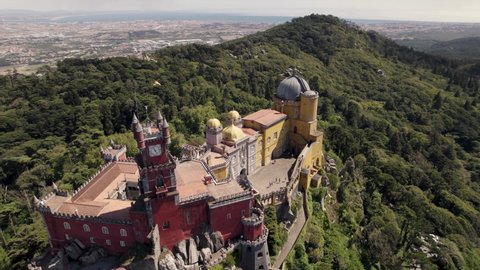 Colourful Pena Palace And National Park In Sintra, Portugal. Aerial orbiting shot